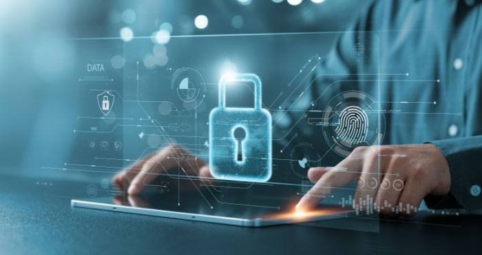 Hands using a tablet with a glowing padlock and security data overlay.